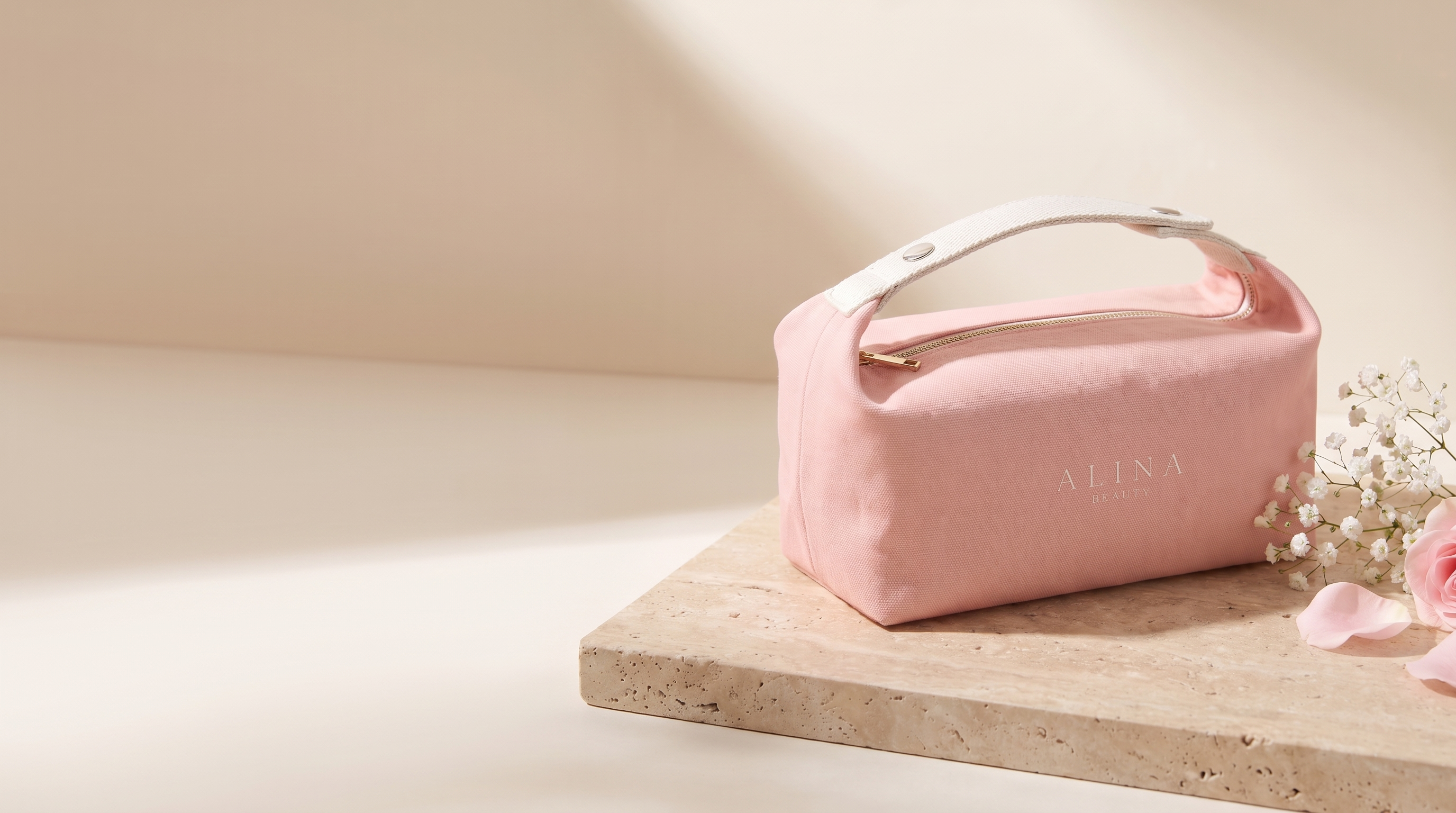 The Alina Beauty Bag on travertine — pre-order hero