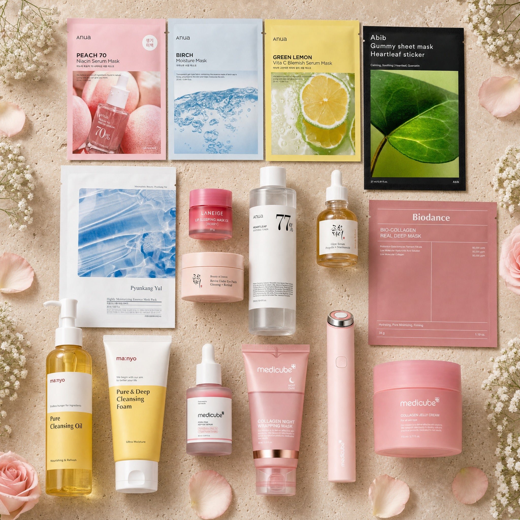 The Full Experience gift set — full lineup incl. Ma:nyo oil & foam, Medicube PDRN Pink Peptide Serum, Night Wrapping Mask and Age-R device on travertine