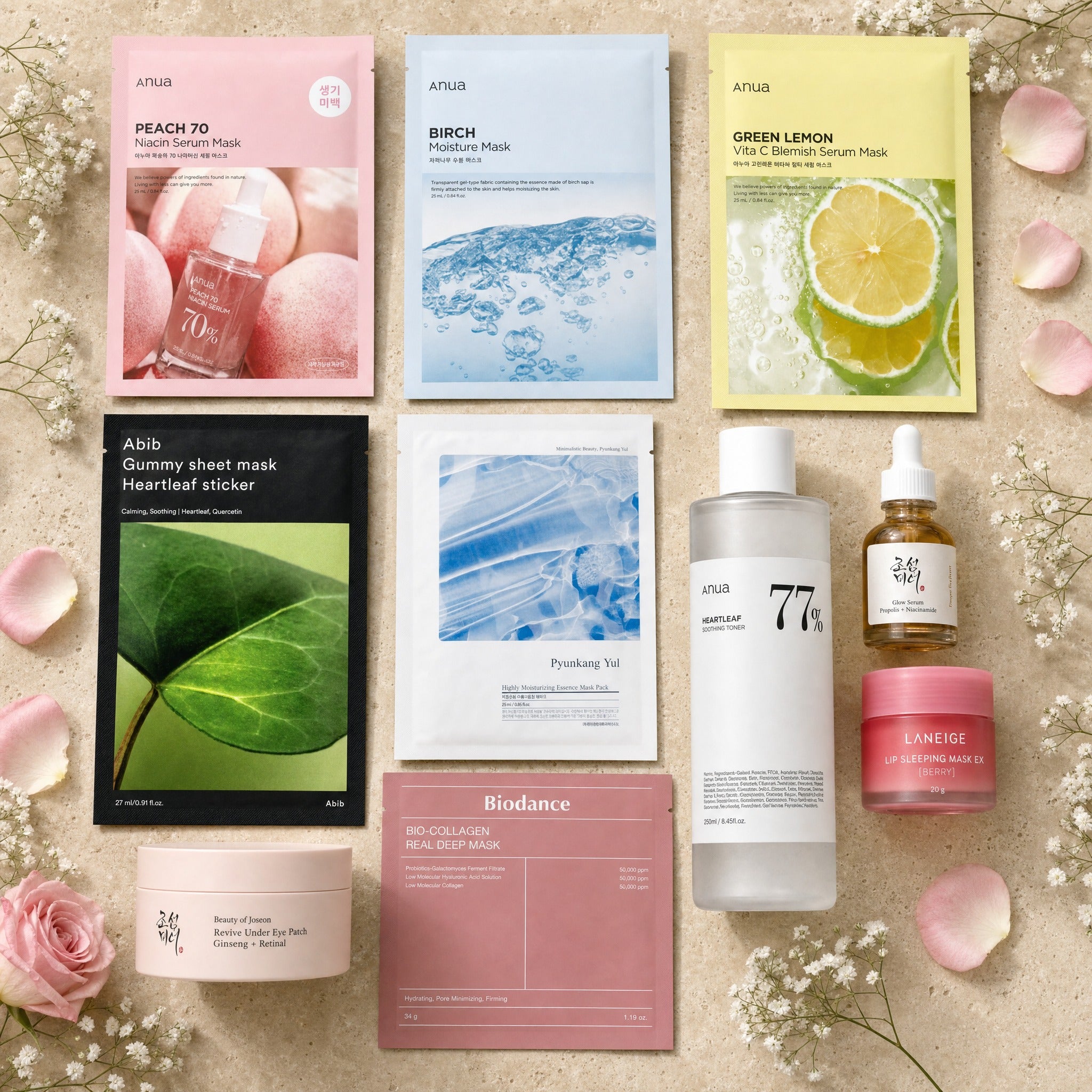 The Full Ritual gift set — the Mini masks plus Anua Heartleaf 77% toner, BoJ Glow Serum and Biodance mask on travertine