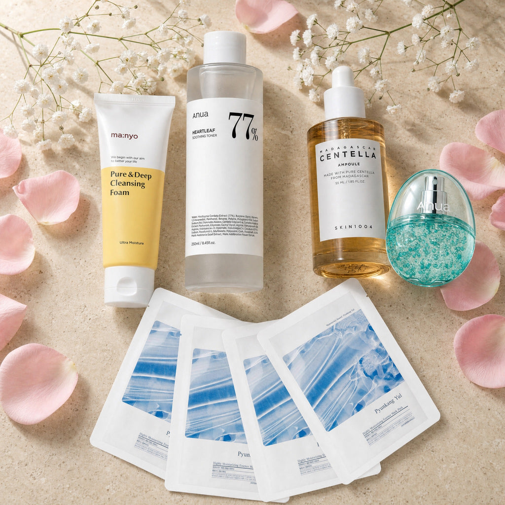 The Pregnancy Calm Set — Ma:nyo cleansing foam, Anua Heartleaf 77% toner, SKIN1004 Centella ampoule, Anua PDRN hydrating mist and four Pyunkang Yul essence masks on travertine
