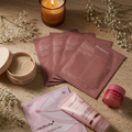 The Overnight Recovery Kit — four fanned Biodance collagen masks, eye patches, lip mask, gel mask and night wrapping mask by candlelight